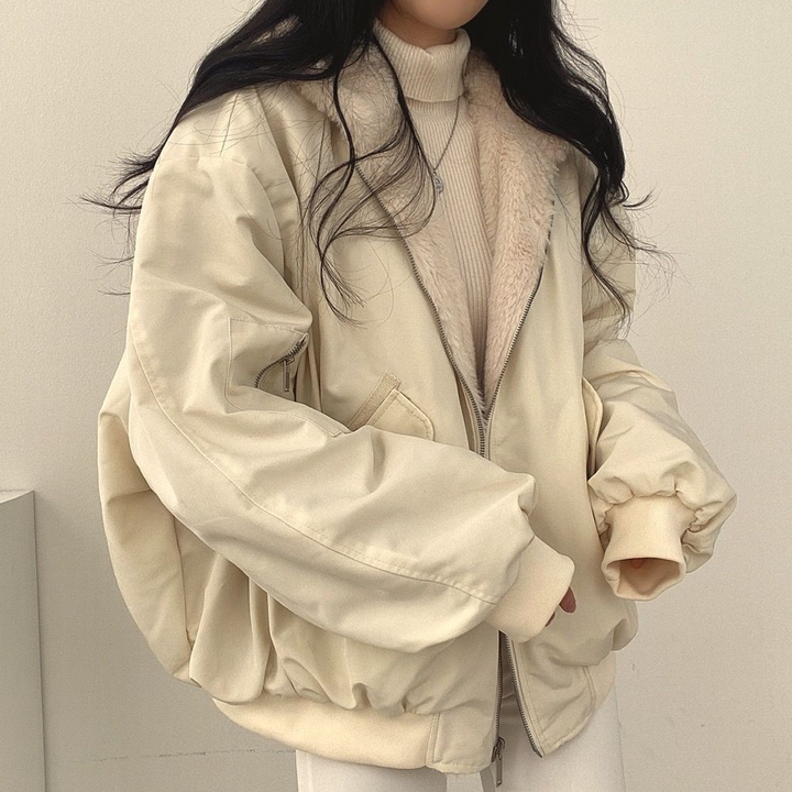 Reversible women's winter jacket displayed in alternate color option