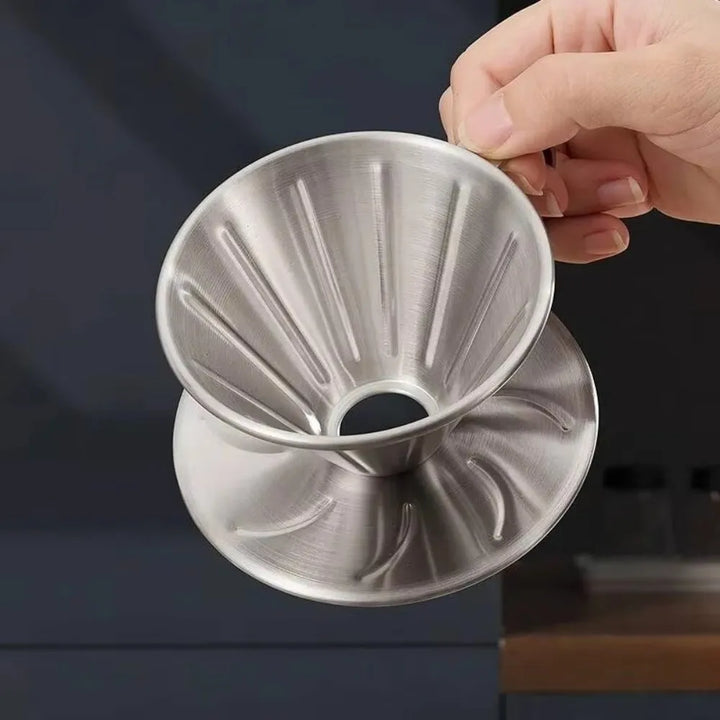 Reusable kitchen gadget coffee dripper placed flat on a clean white surface