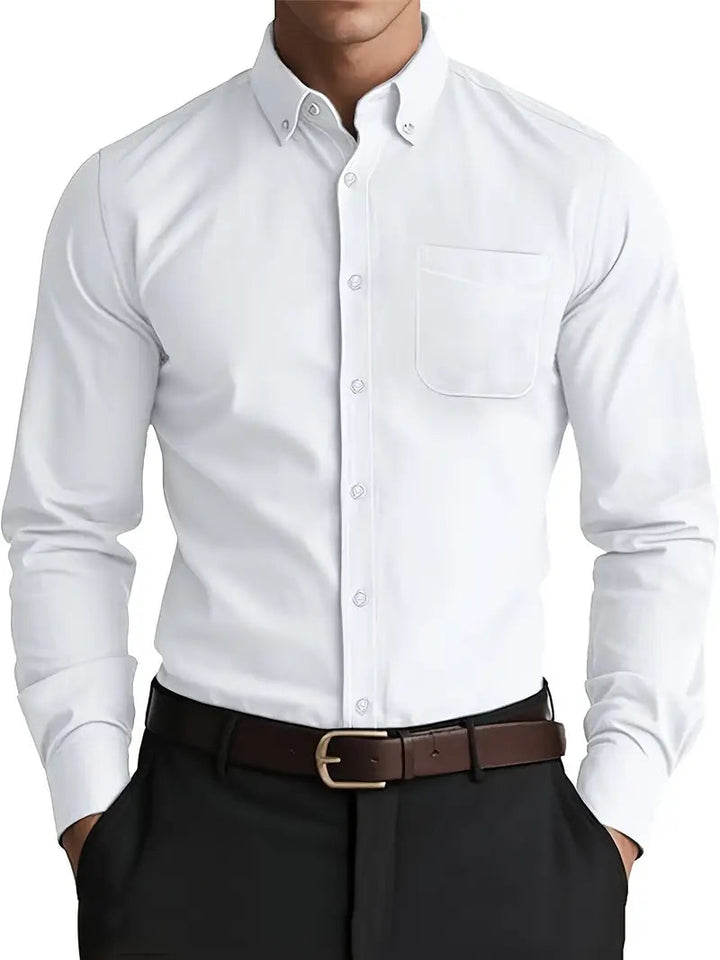 Man wearing a white long sleeve button-down shirt with chest pocket