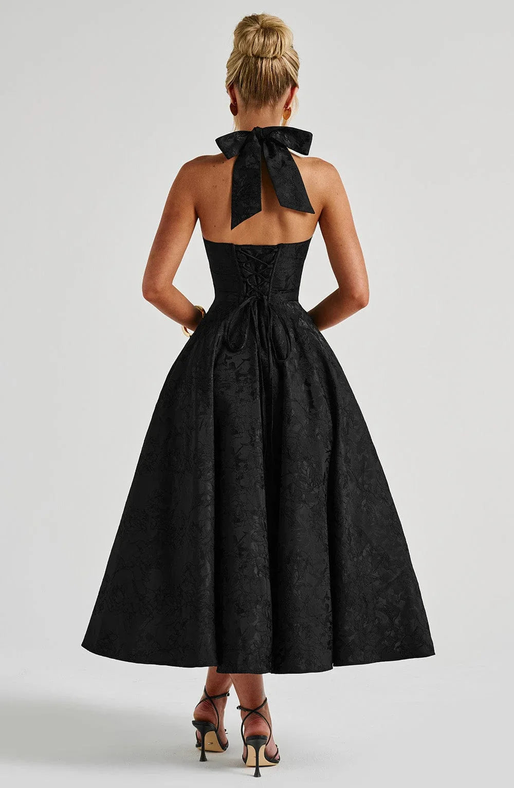 Full length view of women's chic cocktail midi dress
