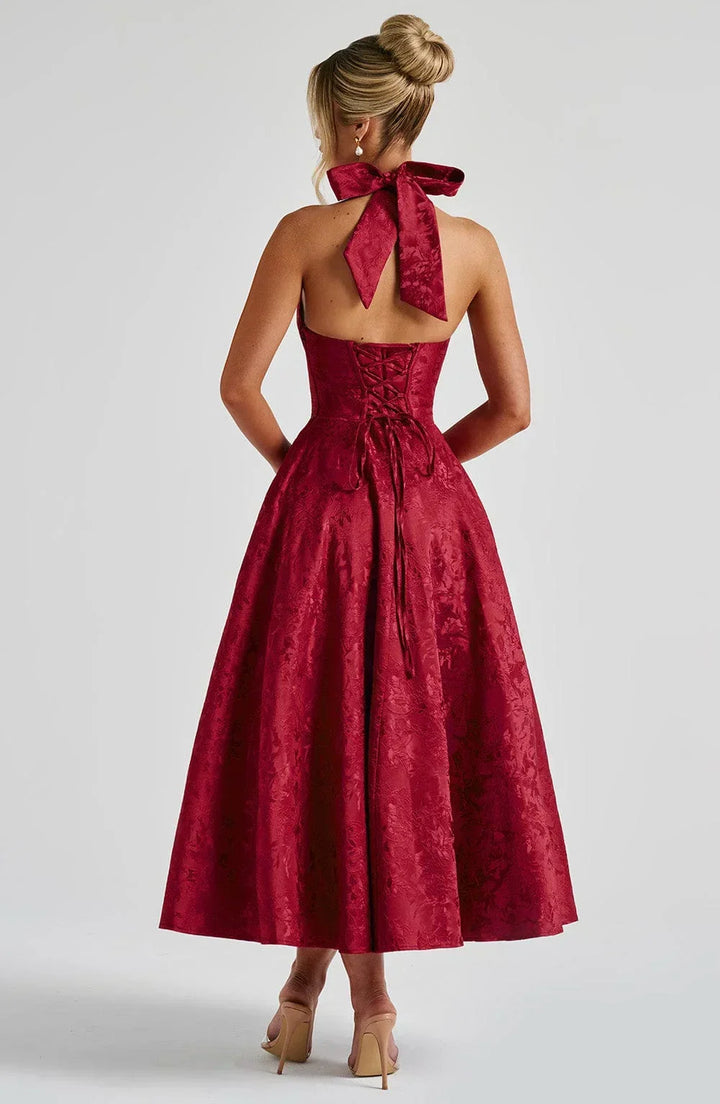 Back view of elegant halter neck cocktail midi dress