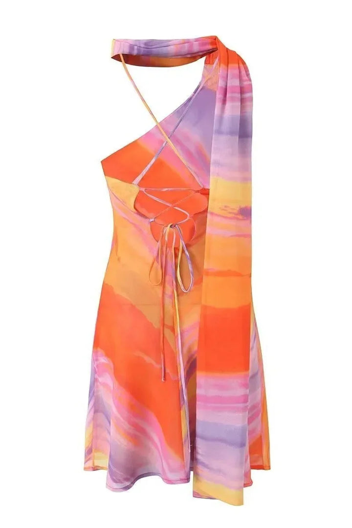 Detailed shot of halter neckline and strap on women's abstract mini dress