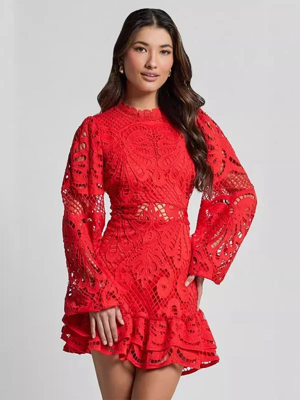Front view of a woman wearing a vibrant red long sleeve lace ruffle mini dress