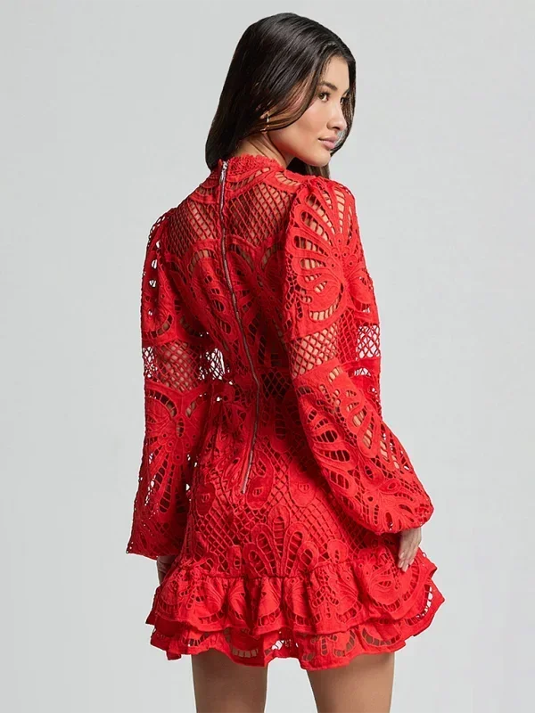 Back view showing the zipper closure and fitted silhouette of the red mini dress