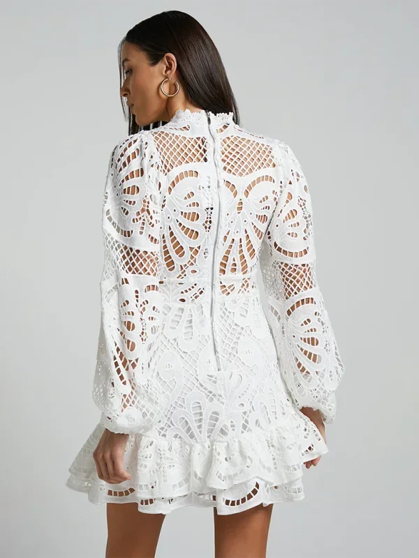 Detailed shot of long sleeve cuff on lace cocktail dress