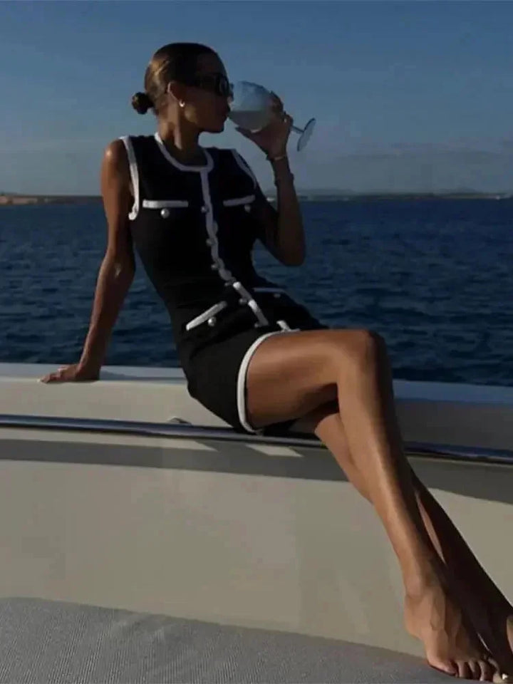 Close-up of contrast trim detail on chic women's sleeveless bodycon dress