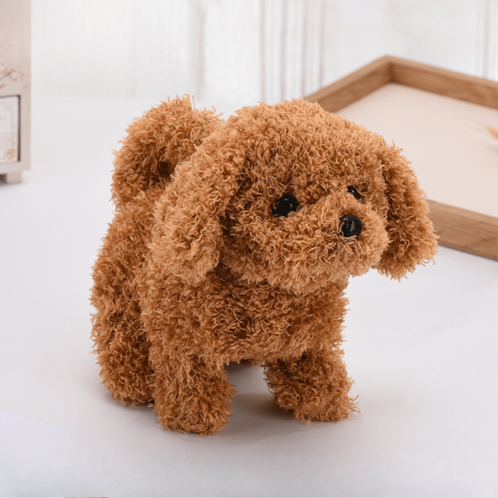 Brown interactive robotic puppy toy sitting on white surface
