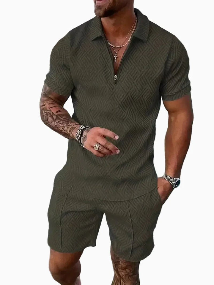 Man wearing an olive green polo shirt and shorts casual outfit