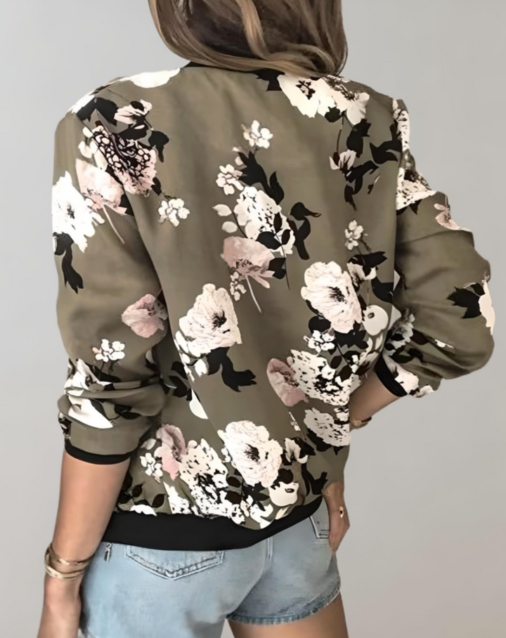 Detailed shot of the zipper and hemline on a fashionable womens floral outerwear piece