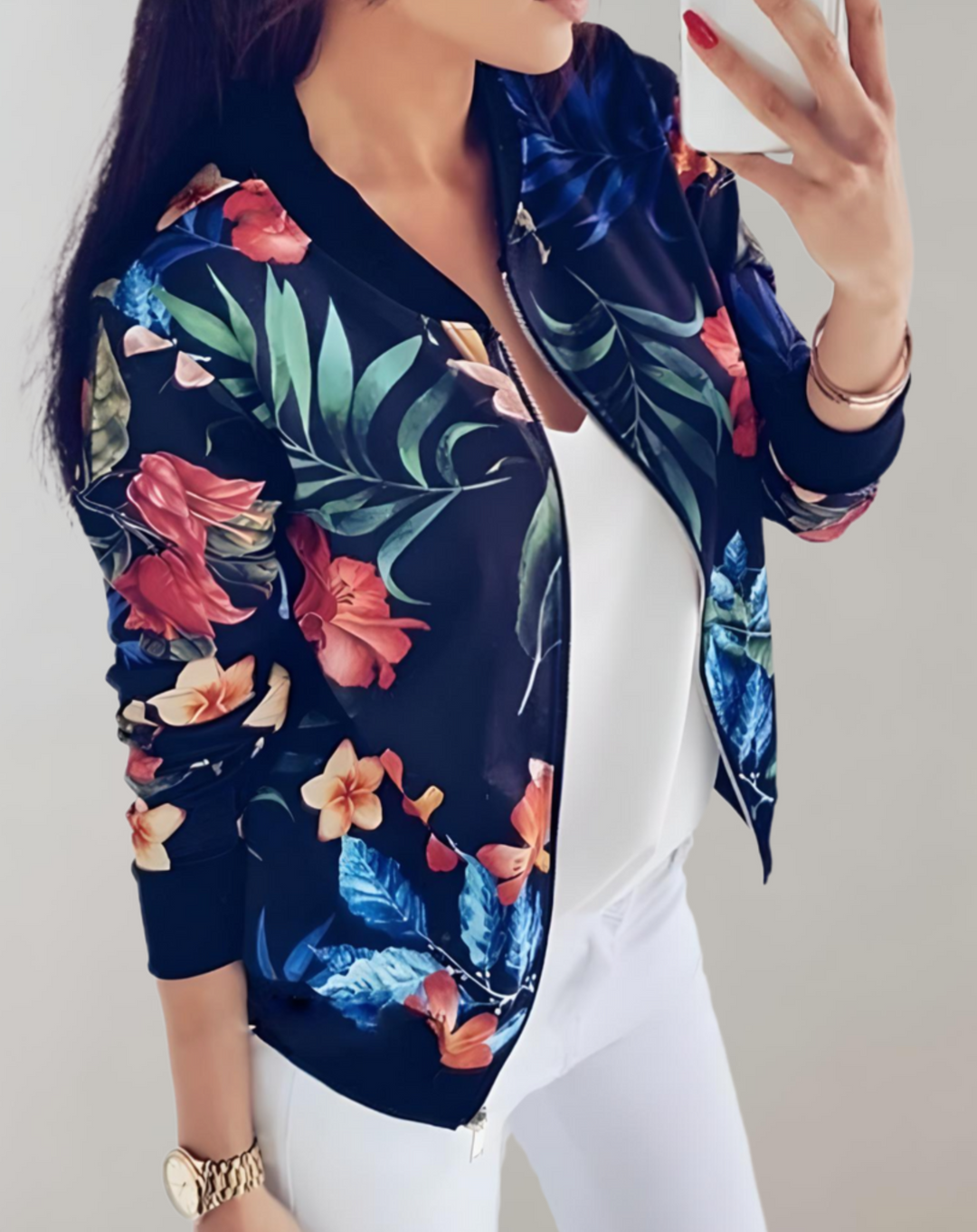 Close-up of the floral pattern fabric and collar on a stylish womens zip-up jacket