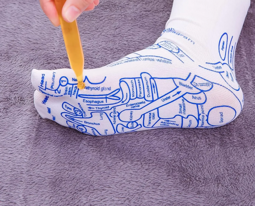 Unisex reflexology massage socks displayed with foot care tool for relaxation