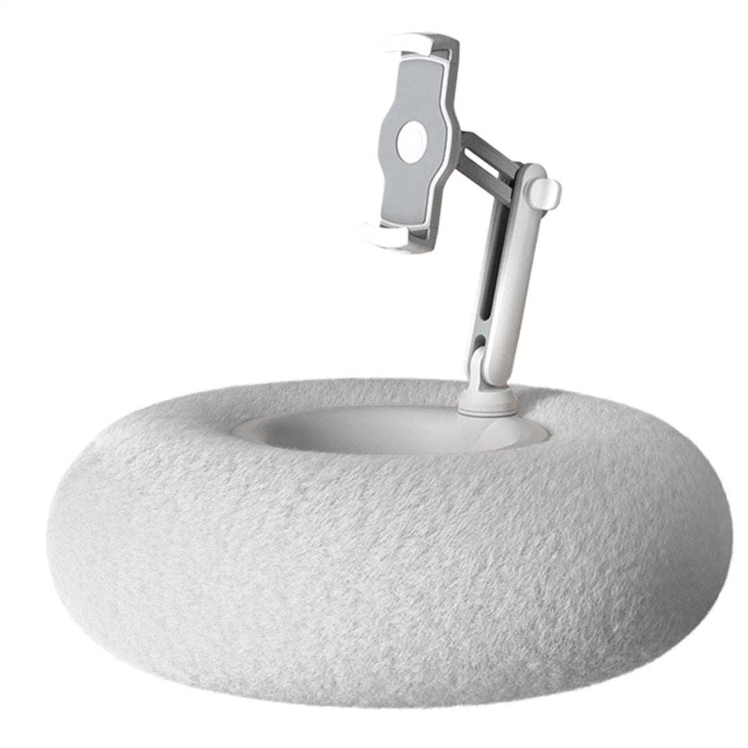 Person using the hands free phone pillow comfort stand while relaxing in bed