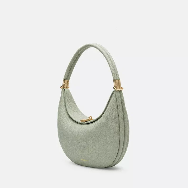 Close-up of the textured vegan leather material and stitching on everyday purse