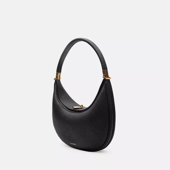Women's versatile chic handbag in neutral tone showing front design and hardware