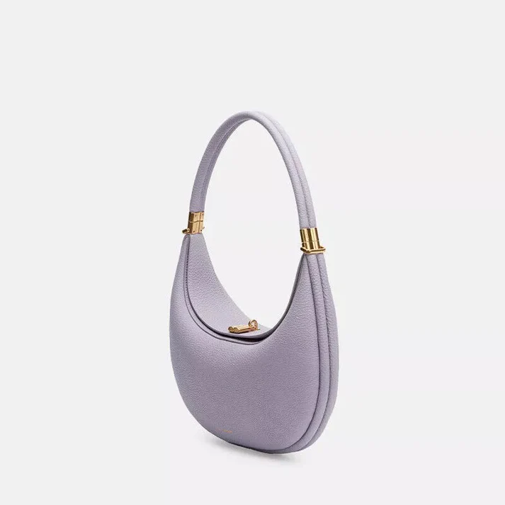 Side profile of women's bag highlighting spacious compartment and slim silhouette