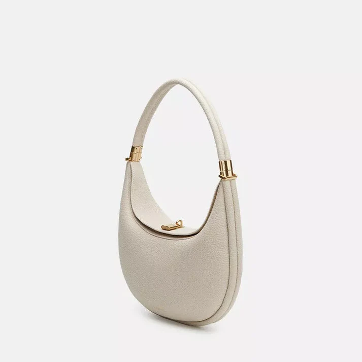 Fashion accessory styled on a model to show scale and shoulder wear