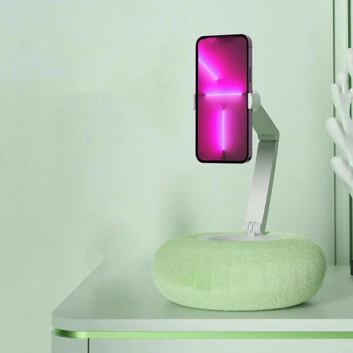 Adjustable mobile phone holder pillow in green for comfortable viewing on bed