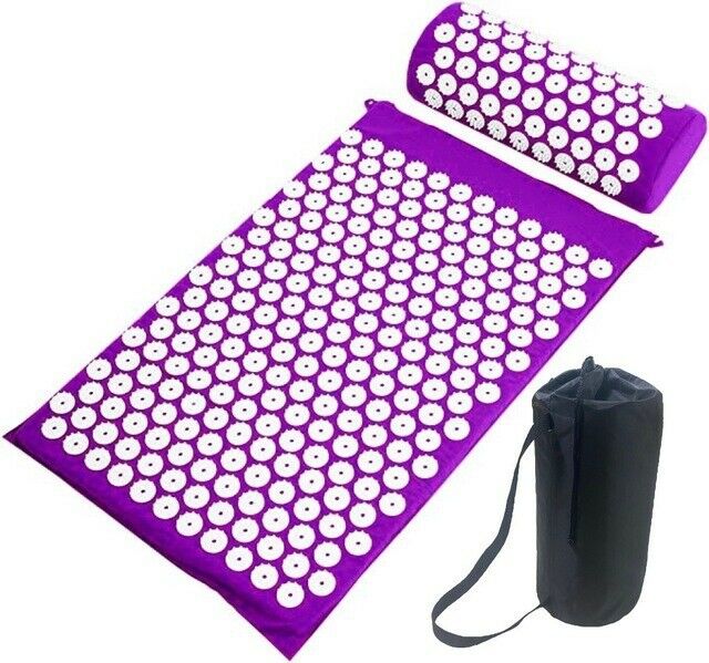 Purple acupressure yoga mat and pillow set laid out with a black carry bag