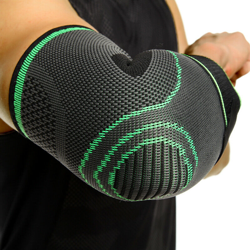 Close-up view of a green and black athletic elbow support sleeve