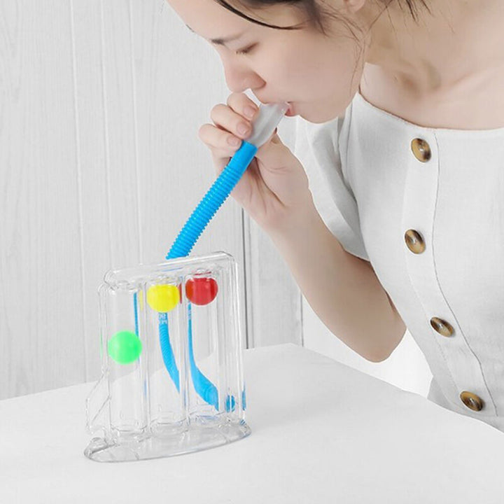 Woman using the TriFlo Inspiratory Exerciser device