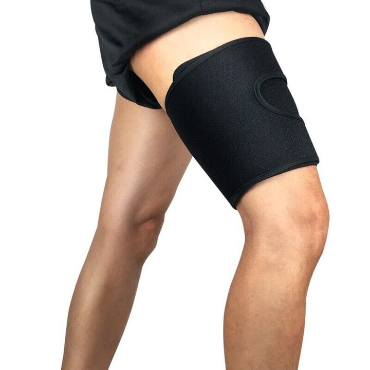 Person wearing black adjustable thigh compression wrap during activity