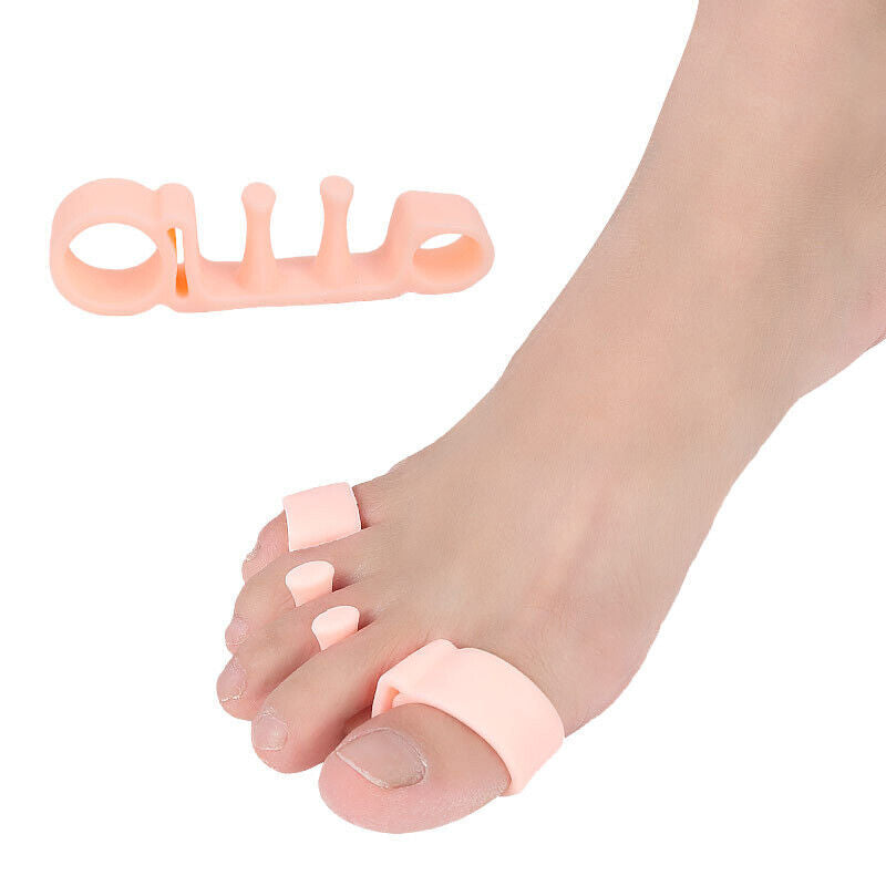 Pink toe separator next to a foot demonstrating placement