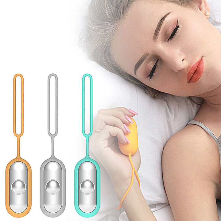 Woman sleeping peacefully while holding the orange sleep aid device