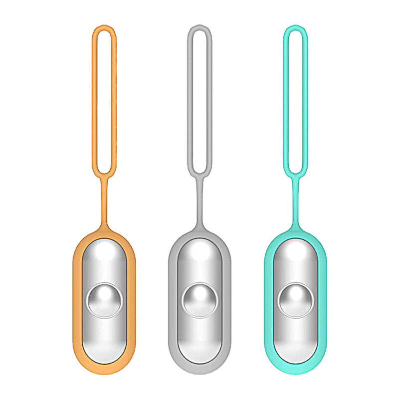 Three portable sleep aid devices in orange, grey, and blue standing upright