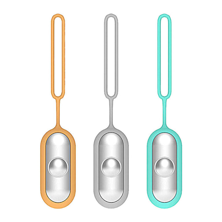 Three portable sleep aid devices in orange, grey, and blue standing upright