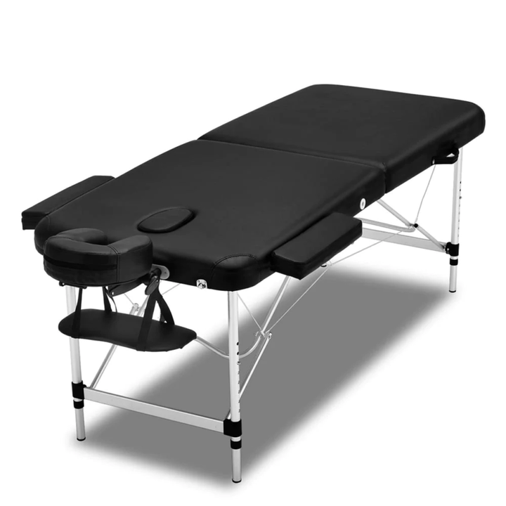 Full view of the ergonomic black massage bed with adjustable face cradle