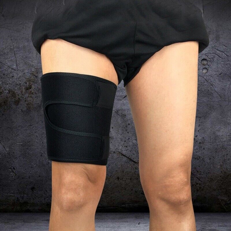 Close-up of black thigh compression wrap secured on leg