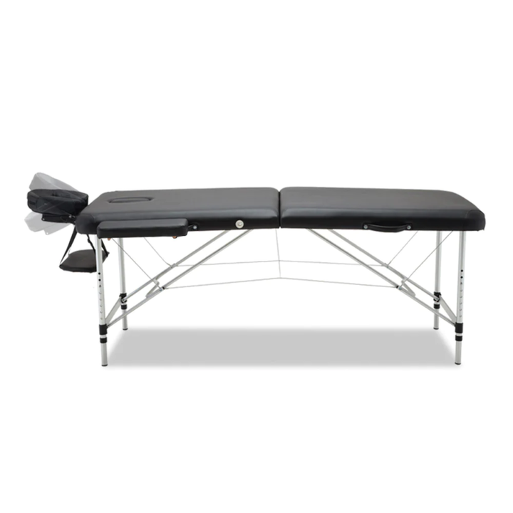 Professional spa bed folded into a compact carry case for easy transport