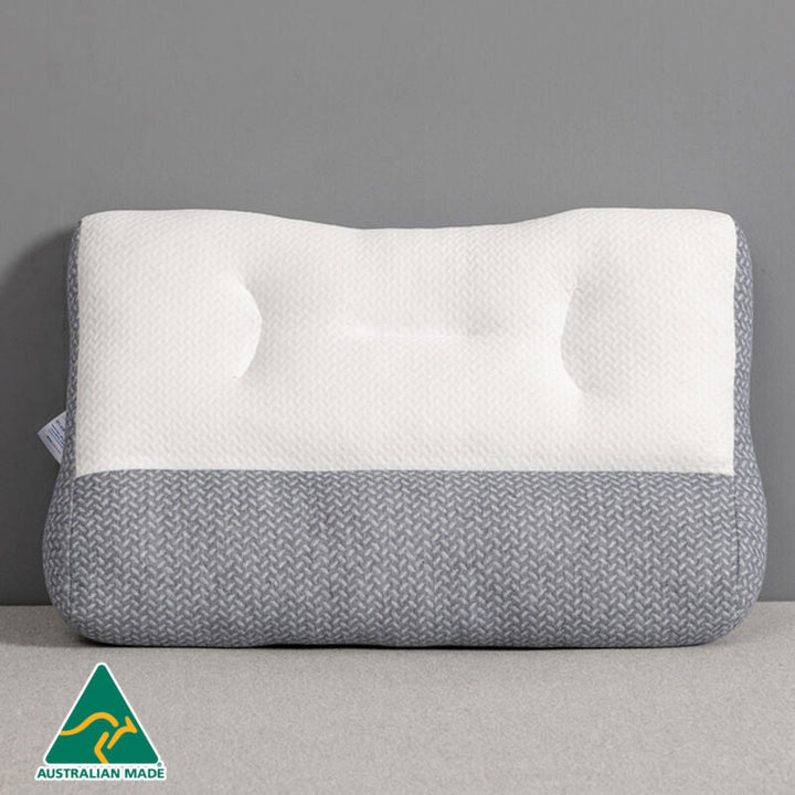Side view of ergonomic sleeping pillow highlighting spinal alignment features