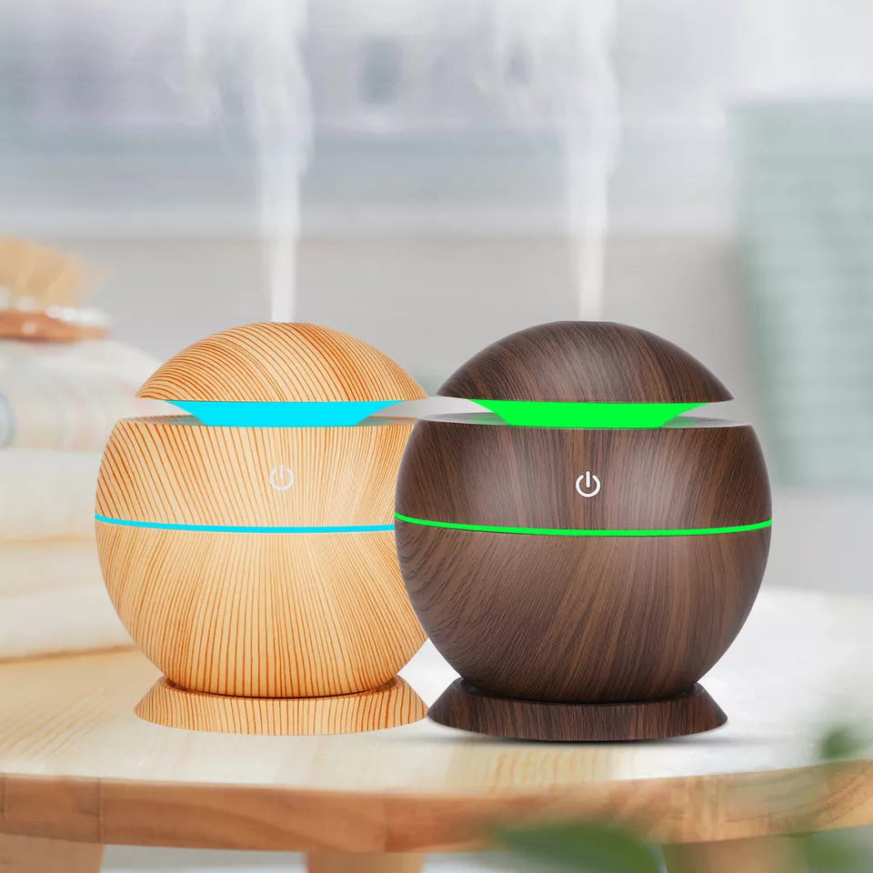 Light Wood and Dark Wood mini aromatherapy diffusers side by side on a table