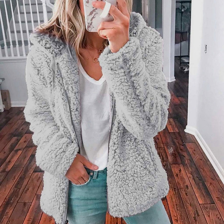 Soft zip-up fleece hoodie for women, ideal for cold weather
