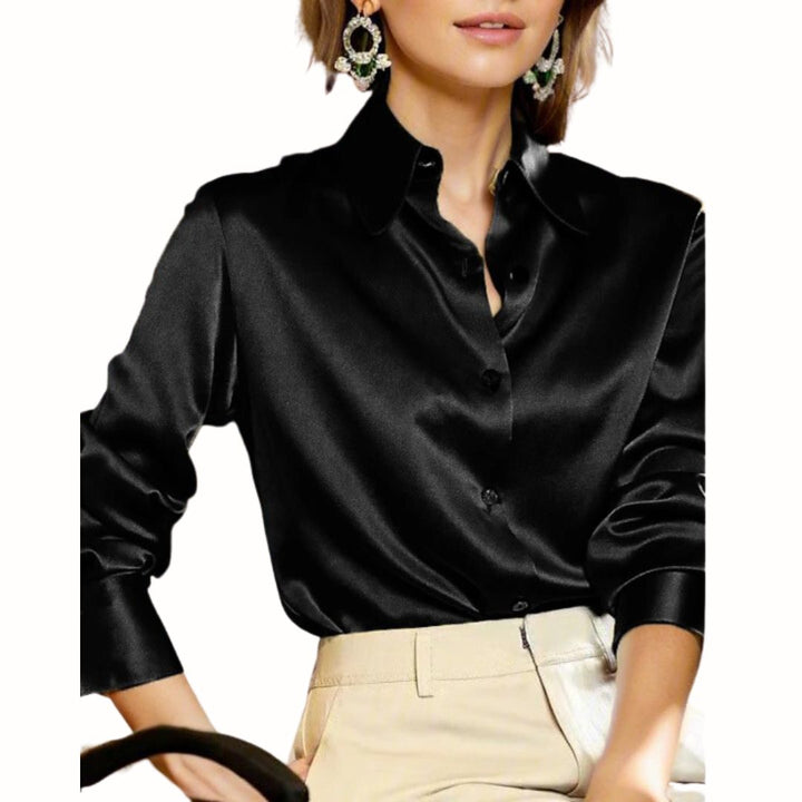 Woman wearing a black button-down blouse with classic collar