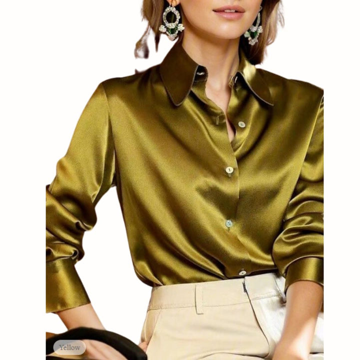 Woman wearing a yellow button-down blouse in a stylish setting