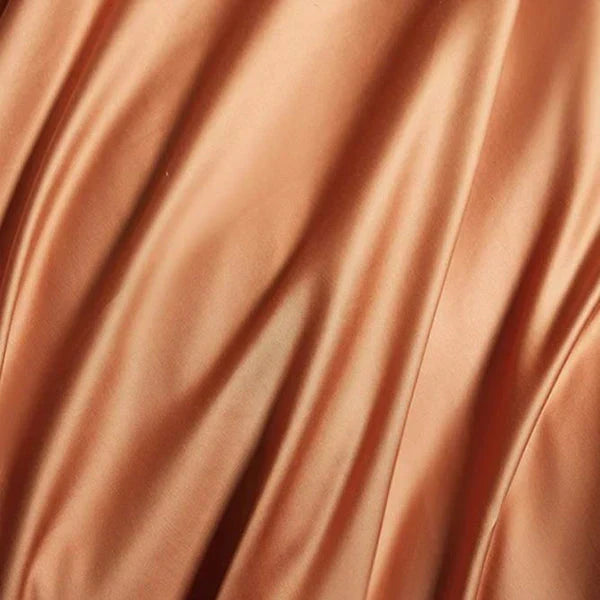 Duvet cover corner detail highlighting soft satin fabric and embroidery