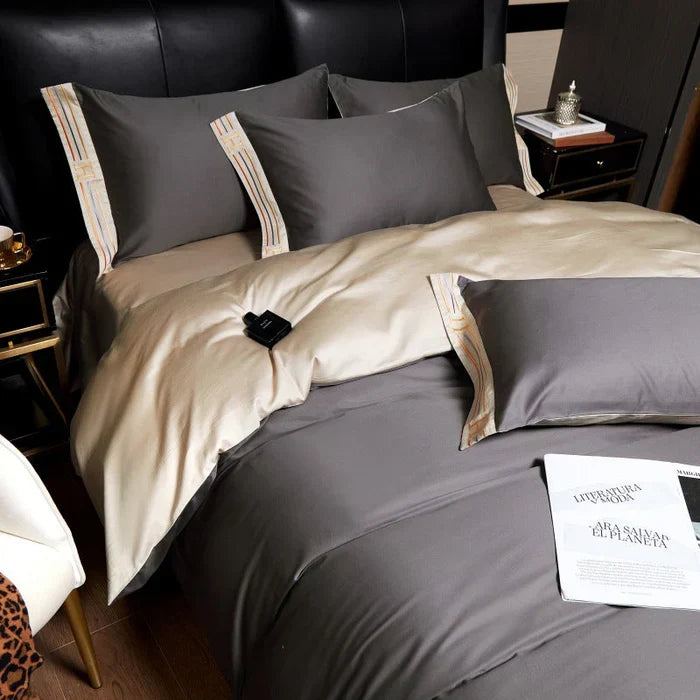 Close-up of luxury grey satin pillowcases with decorative embroidery