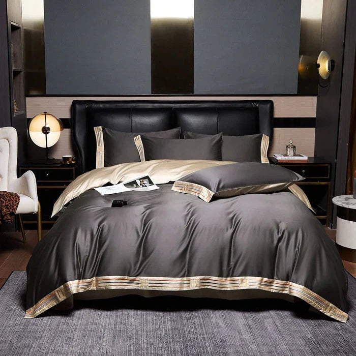 Full view of elegant grey bedding set with coordinated pillows and duvet