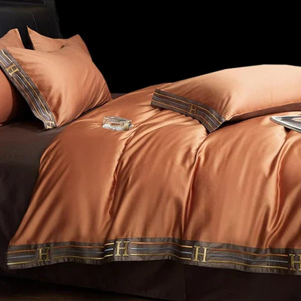 Decorative bedroom accessories styled with premium embroidered sheets
