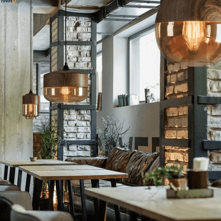 Indoor lighting showcase of the sleek glass shade hanging lamp turned on