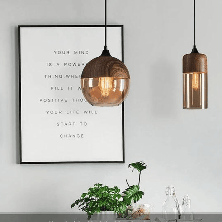 Angle view of the minimalist design pendant light against a neutral wall