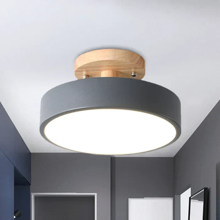 Minimalist Scandinavian LED ceiling lamp angled view showcasing modern nordic lighting design