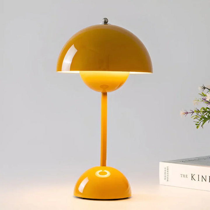 Battery operated desk lamp illuminating a contemporary living space surface