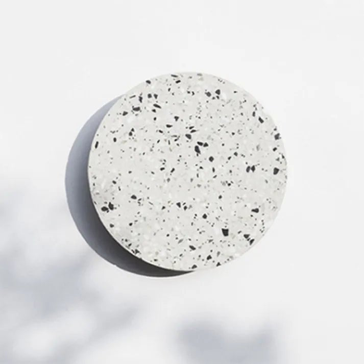 Close-up detail of energy efficient LED wall light featuring stylish terrazzo decor