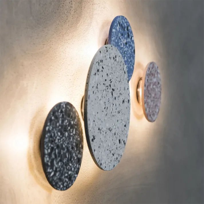 Minimalist Scandinavian terrazzo LED wall lamp illuminating a cozy modern hallway