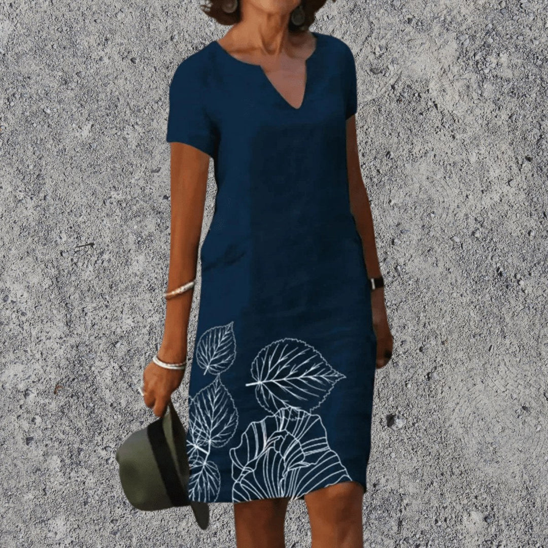 Woman wearing Dark Blue V-Neck Midi Dress with leaf hem design