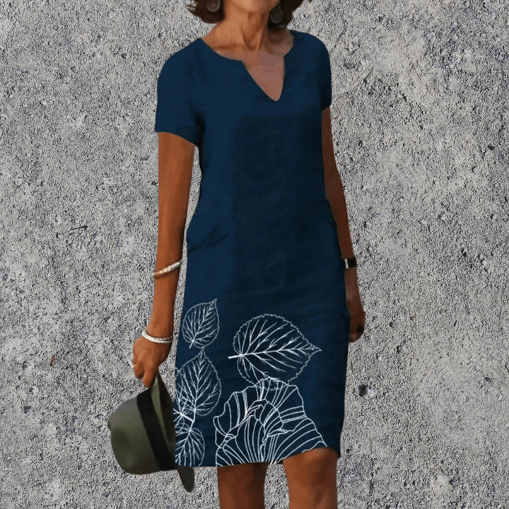 Woman wearing Dark Blue V-Neck Midi Dress with leaf hem design