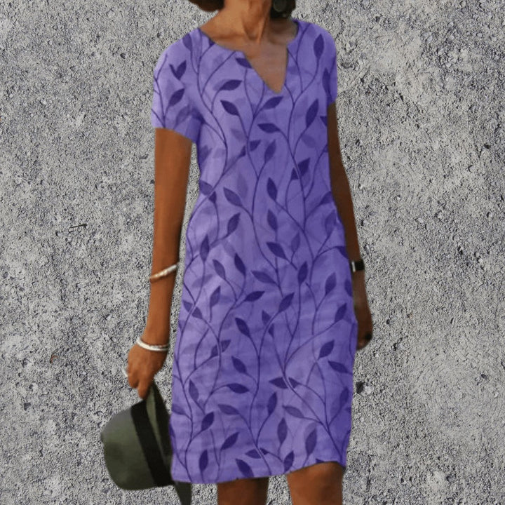 Woman wearing Purple V-Neck Midi Dress with botanical print